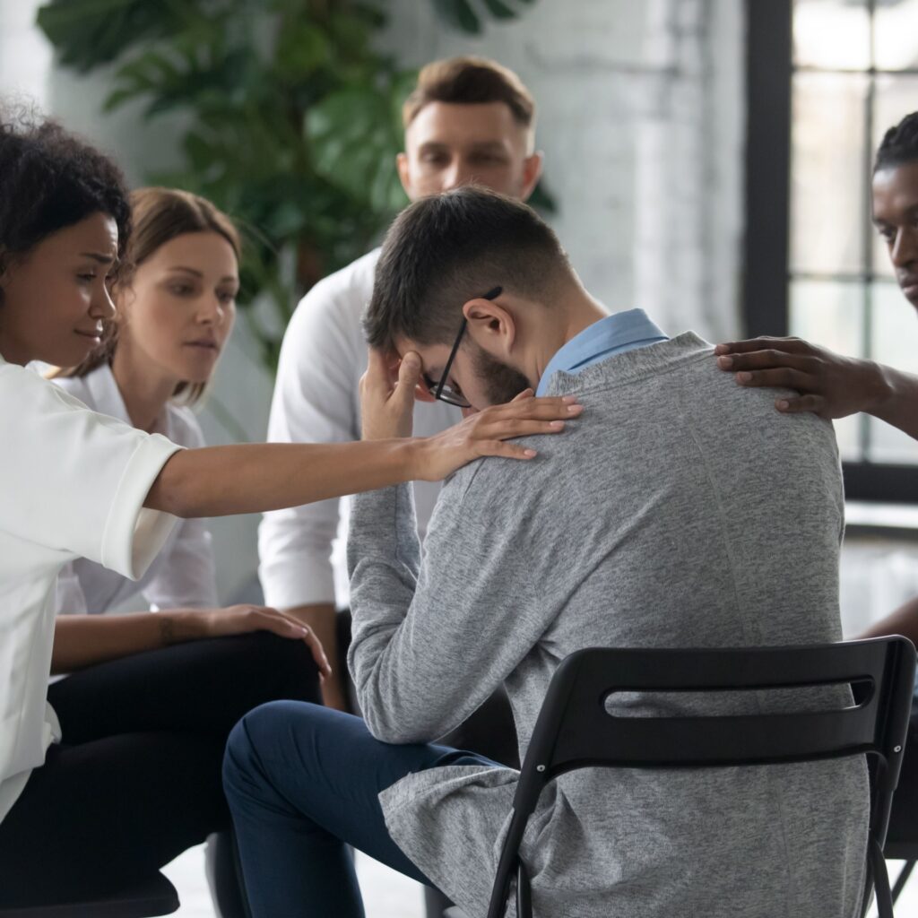 Group participating in drug addiction treatment activities