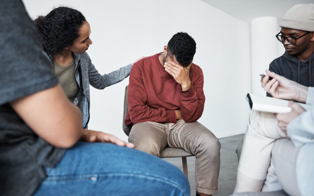 Grief, meeting and support group with people in circle together for communication, depression or mental health