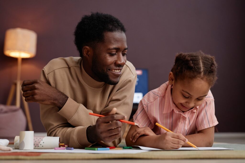 A parent and child sharing a quiet moment of connection, illustrating how to help children understand parental addiction through safe, predictable routines.